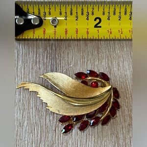 Vintage BS.K signed statement brooch w/faceted red stones